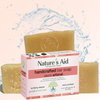 Nature's Aid handcrafted bar soap with packaging on a water splash background