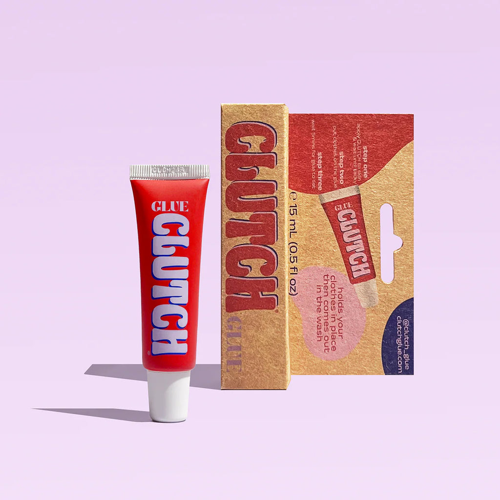 Red 'Clutch' glue tube and packaging on a light purple background
