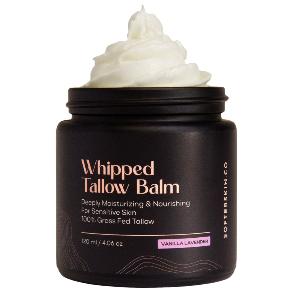 Whipped tallow balm jar with cream on top on a white background